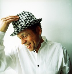 Garland Jeffreys Sports A  Checkered  Hat / photo by  Danny Clinch 