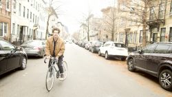 Sam Rappaport On His Bicycle/ photo by John LaRosa/ courtesy of the artist